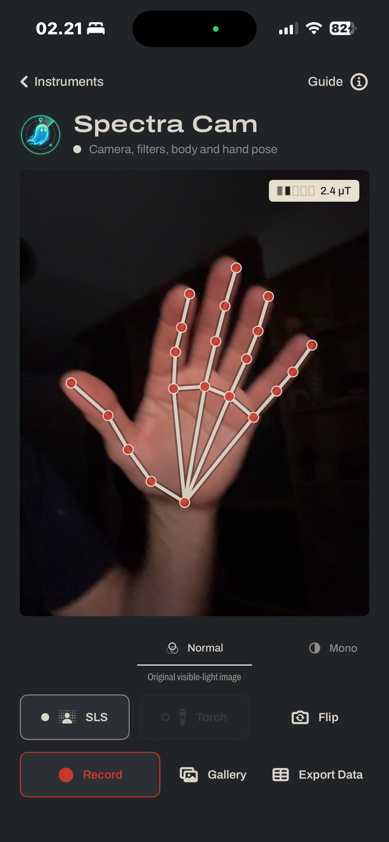 Spectra Cam screen: camera view of a raised hand with the SLS hand-pose skeleton drawn over it